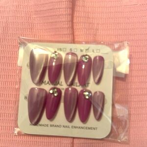 Beautiful pink and purple cat eye nail design